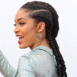 Curly faux locs is the answer to a super girly and sophisticated look.