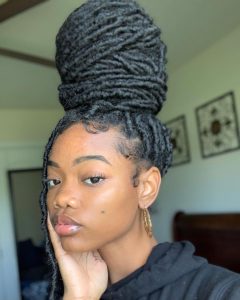Dreadlocks high bun natural style
